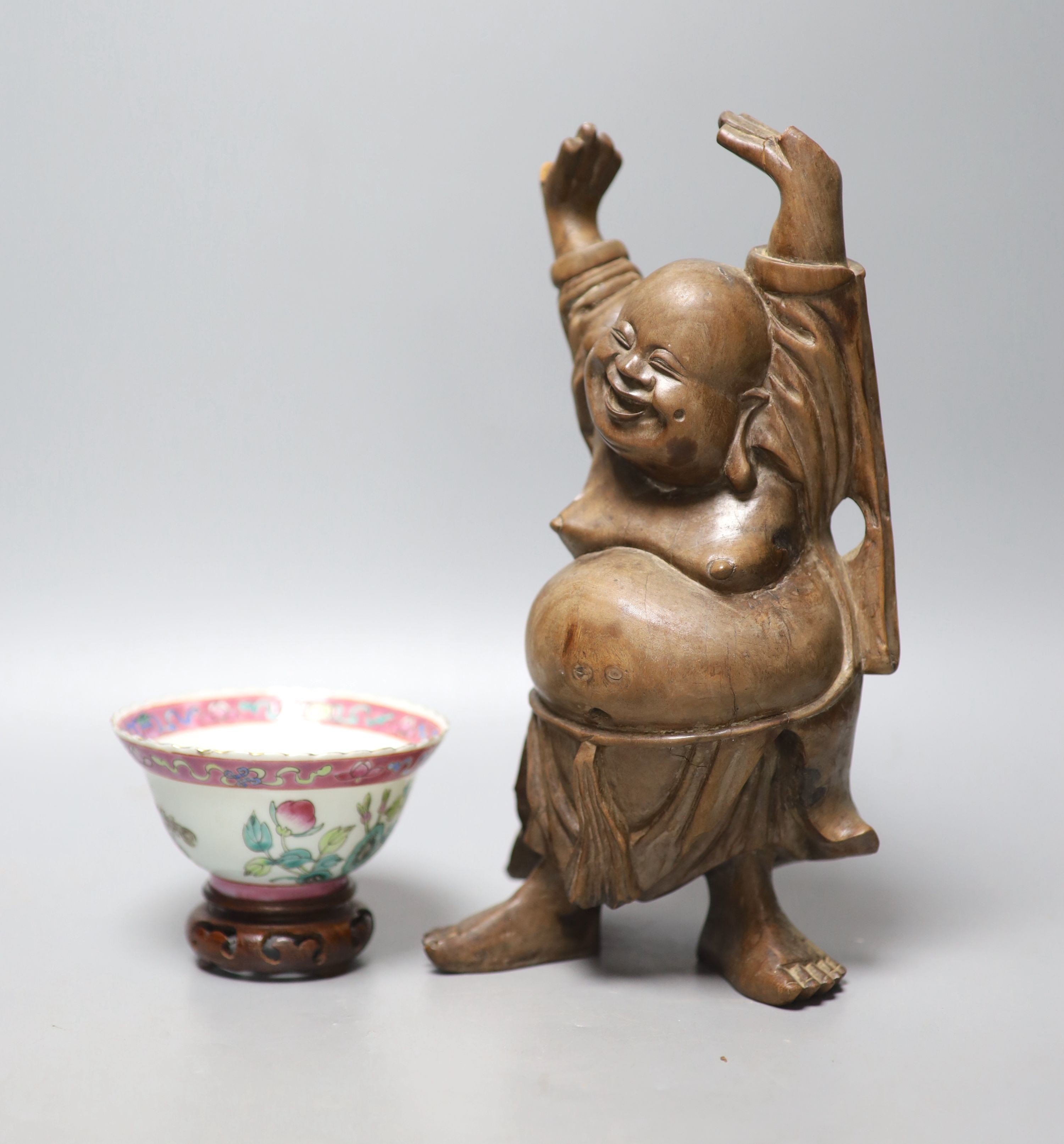 A Chinese Straits famille rose ‘dragon’ bowl, 11cm, and a carved wood figure of a Budai, 28cm